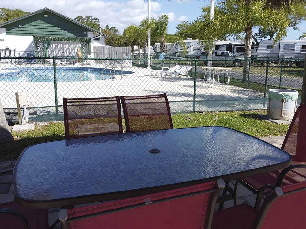 A table outside of the swimming pool area at SONRISE PALMS RV PARK