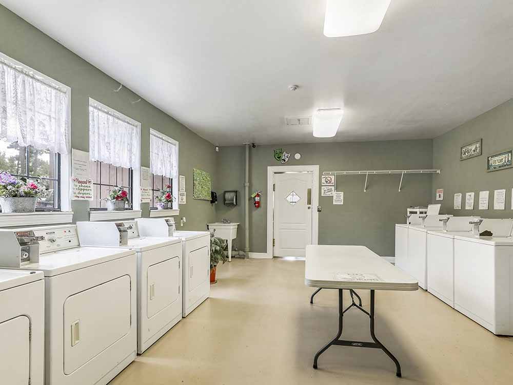 Inside of the modern laundry room at PINE CREST RV PARK OF NEW ORLEANS