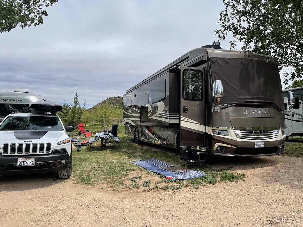 A motorhome in a gravel RV site at BAUER'S CANYON RANCH RV PARK
