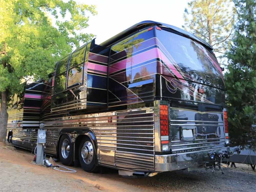 A bus conversion in a RV site at YOSEMITE PINES RV RESORT AND FAMILY LODGING