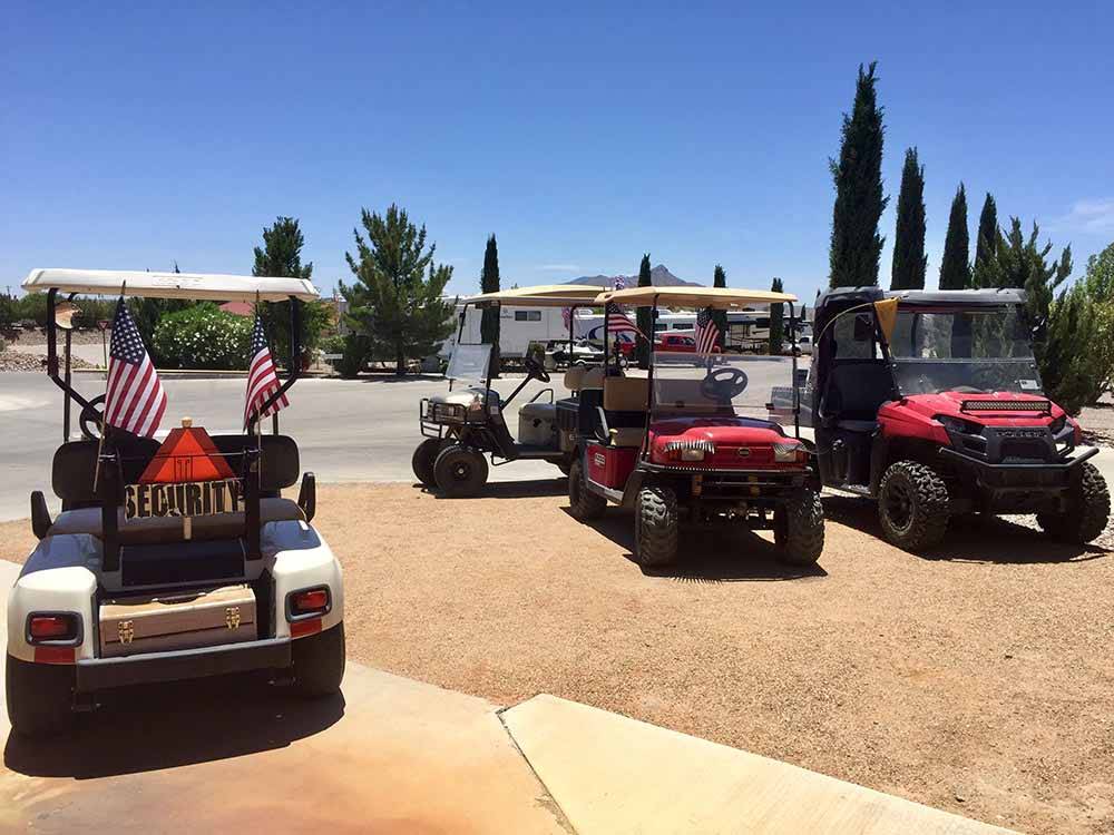 Campground with four golf carts at ELEPHANT BUTTE LAKE RV RESORT