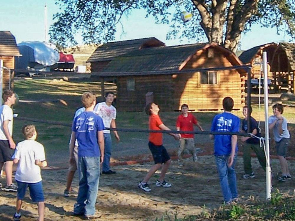 Group of people playing volleyball at ANGELS CAMP RV RESORT