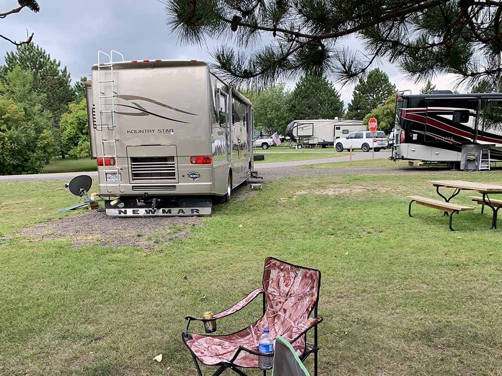 A motorhome in a back in RV site at SHERWOOD FOREST CAMPGROUND