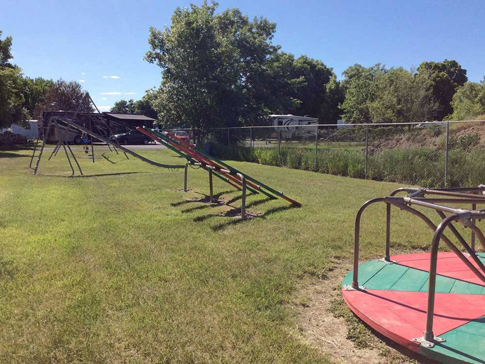 Playground with swing at BILLINGS VILLAGE RV PARK