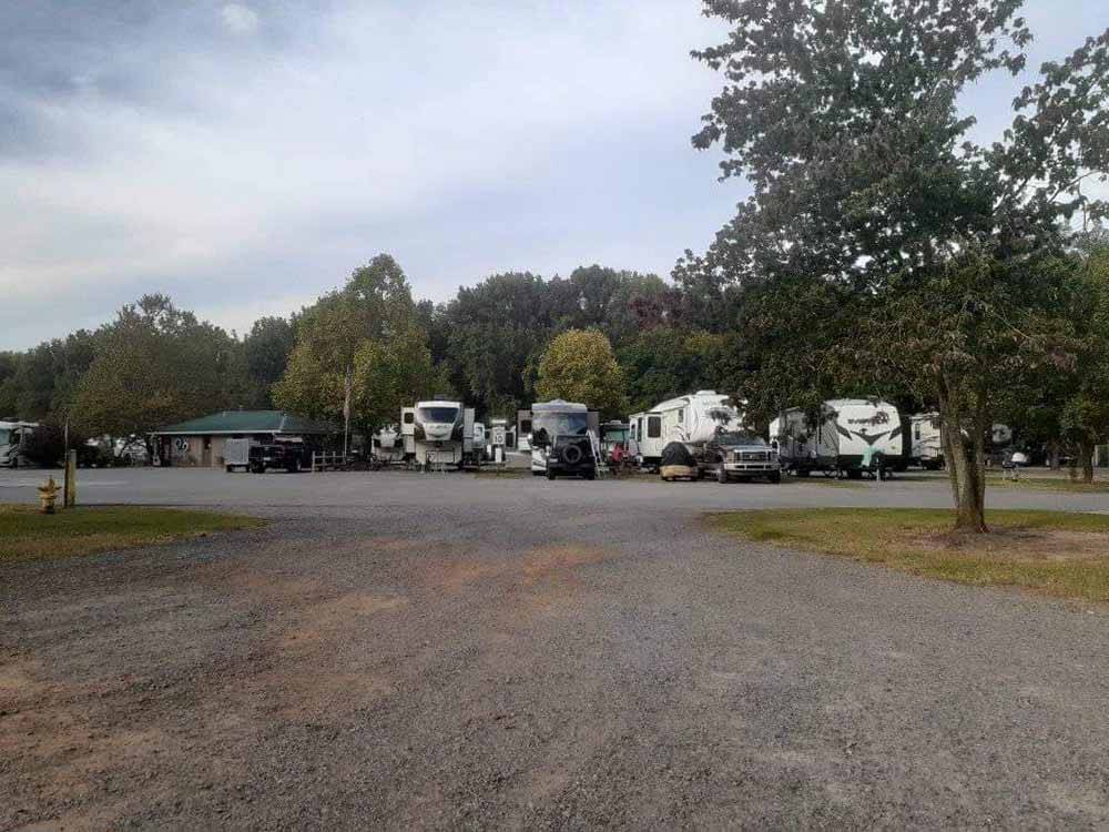 Gravel road leading to RVs at OUTDOOR LIVING CENTER RV PARK