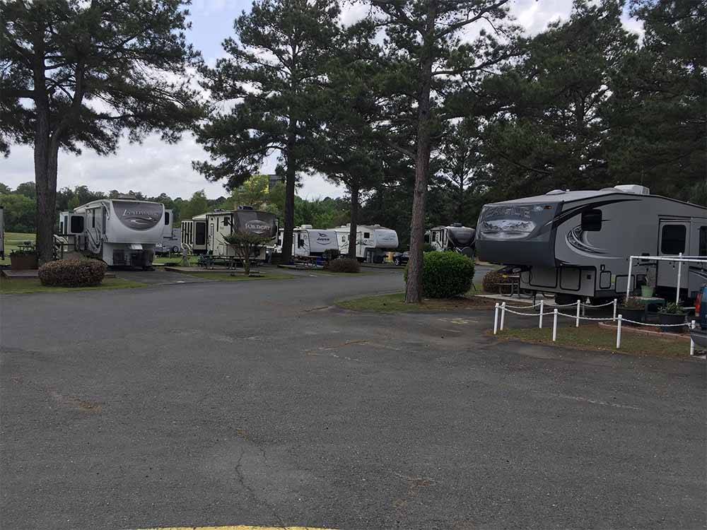 Some of the campsites with trees at TRAVELCENTERS OF AMERICA RV PARK