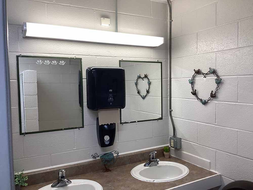 The clean bathroom sinks at TRAVELCENTERS OF AMERICA RV PARK