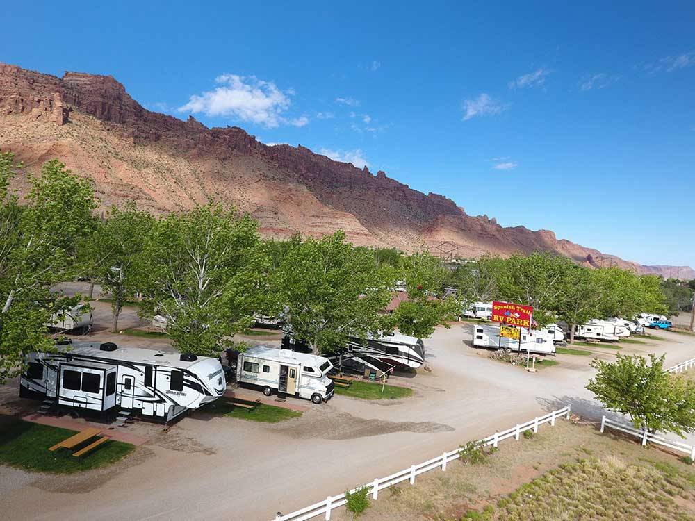 Aerial view of RVs with mountains in background at SPANISH TRAIL RV PARK