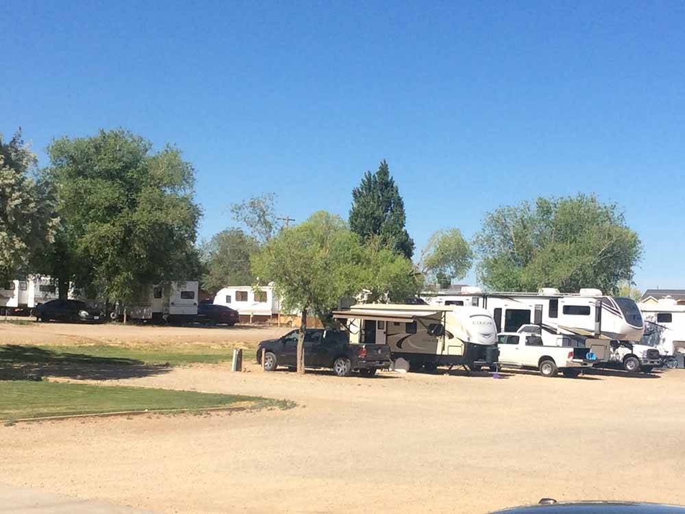 A row of gravel RV sites at BLANDING RV PARK