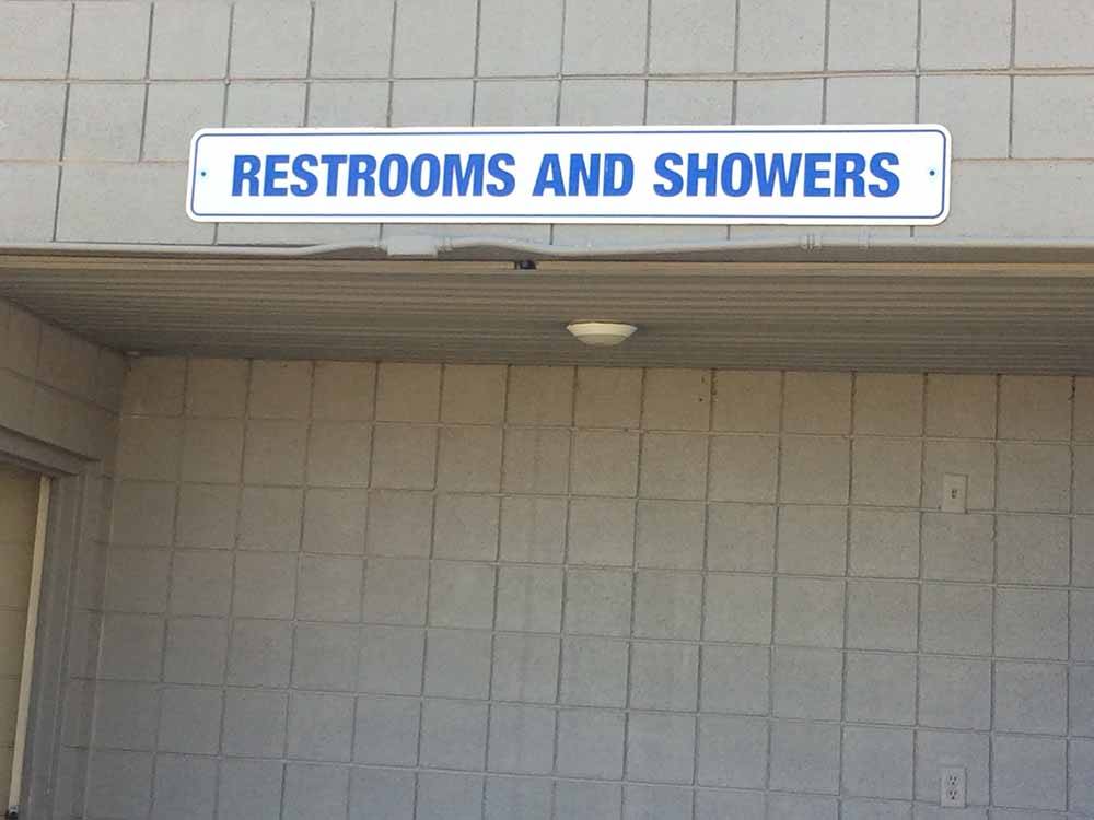The sign to the restrooms and showers at BLANDING RV PARK