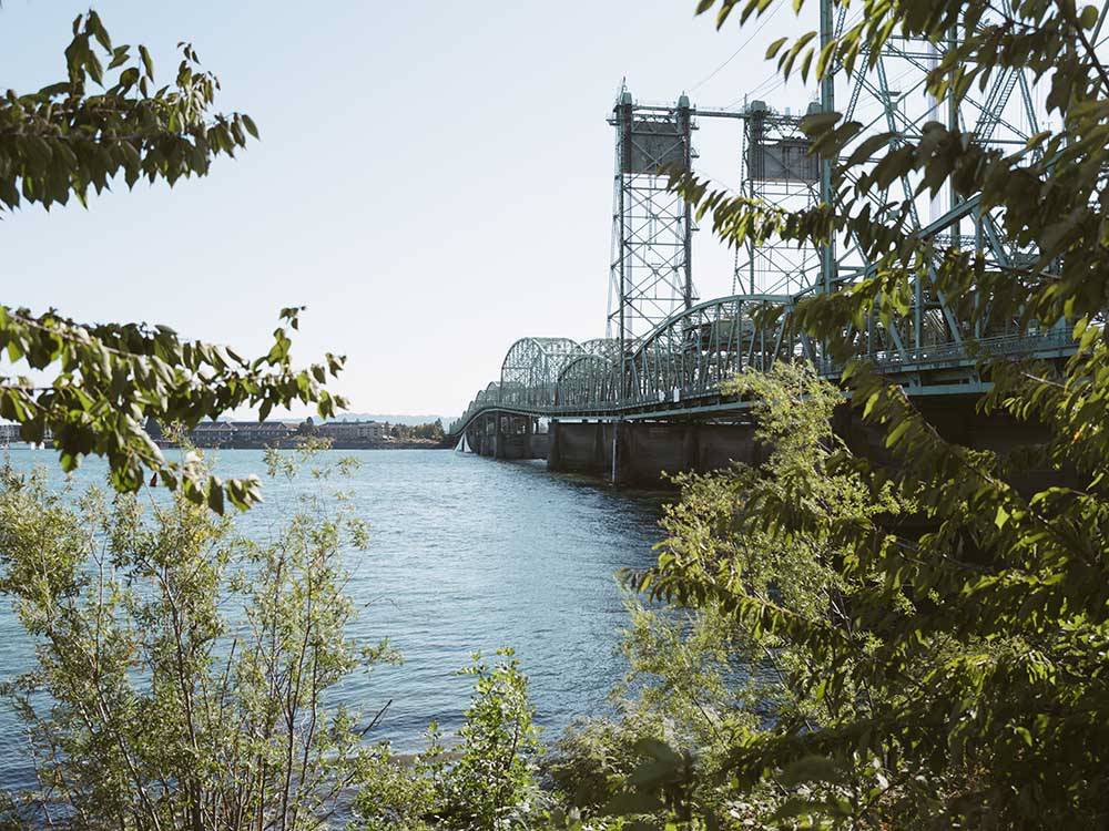 A metal bridge over a river at VANCOUVER RV PARK