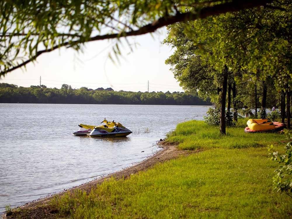 A couple of personal jet skis on the water at LOYD PARK CAMPING CABINS & LODGE