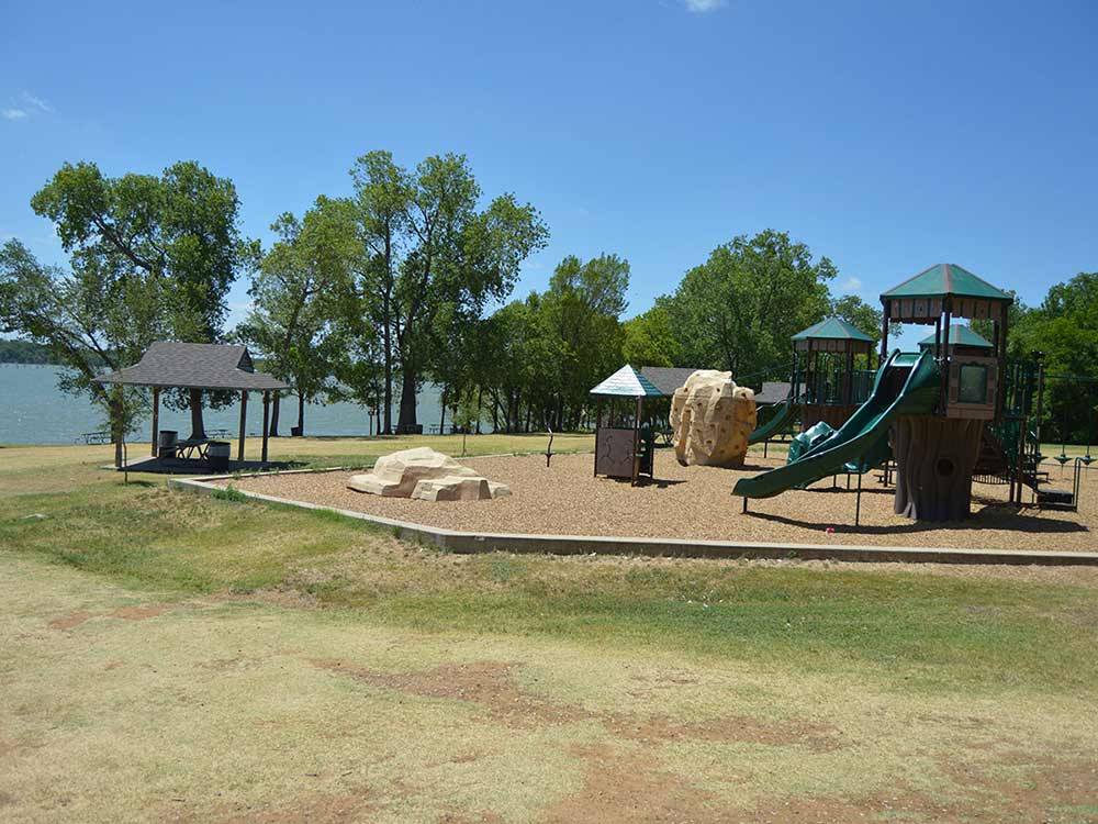 Playground with swing at LOYD PARK CAMPING CABINS & LODGE