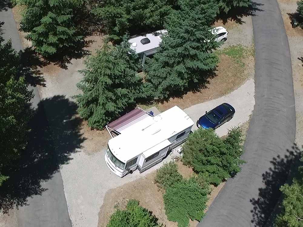 An aerial view of a pull thru RV site at WHISPERING PINES RV CAMPGROUND