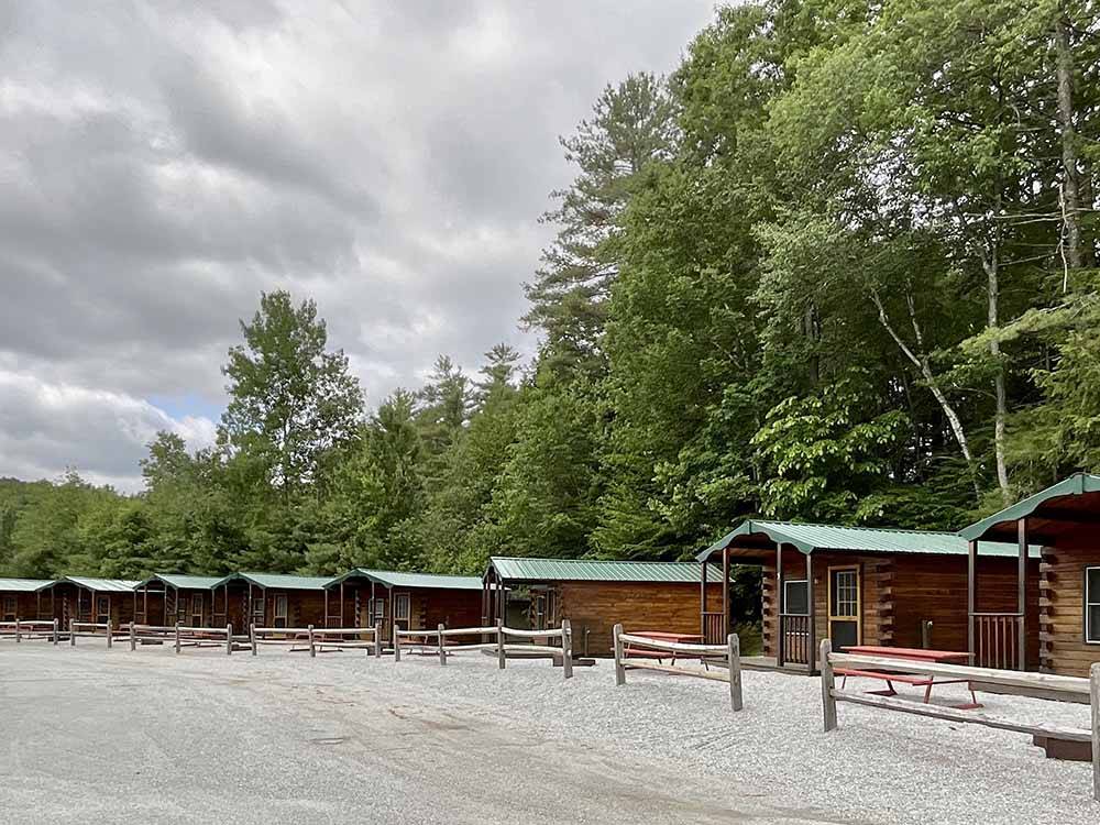 A row of rental log cabins at COLD SPRINGS CAMP RESORT