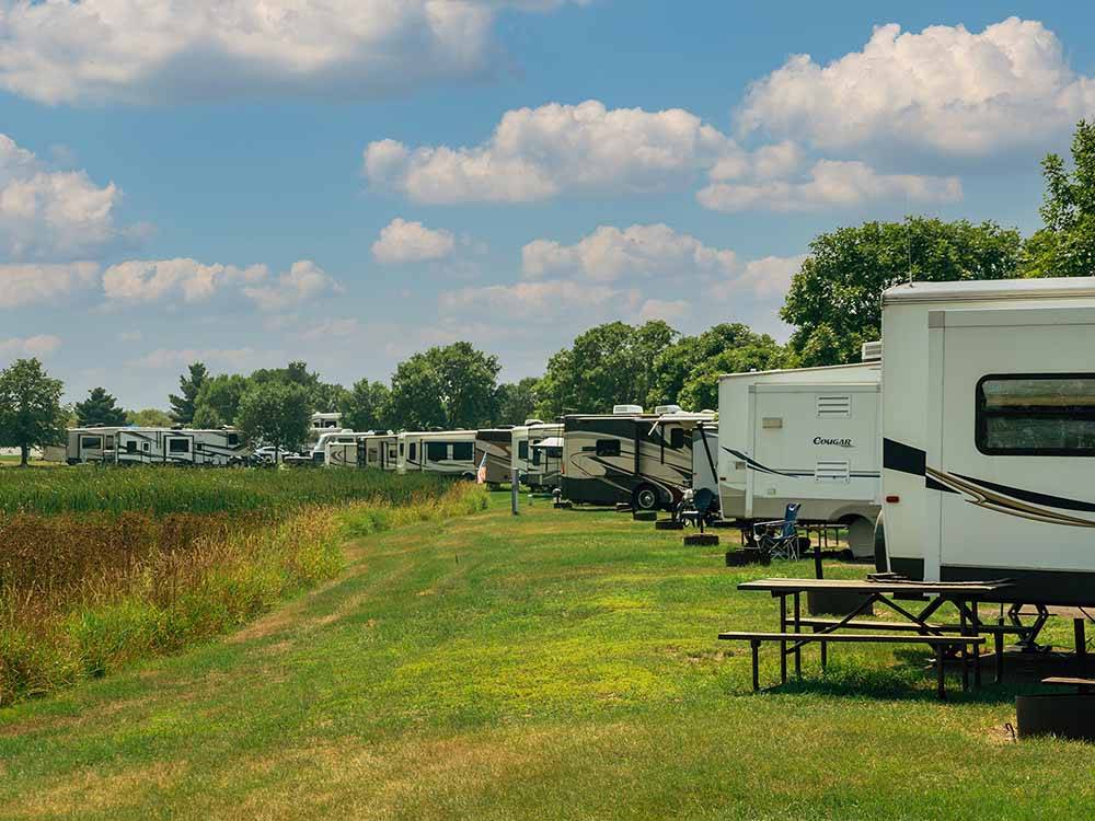 A line of grassy RV sites at GRAND HINCKLEY RV RESORT