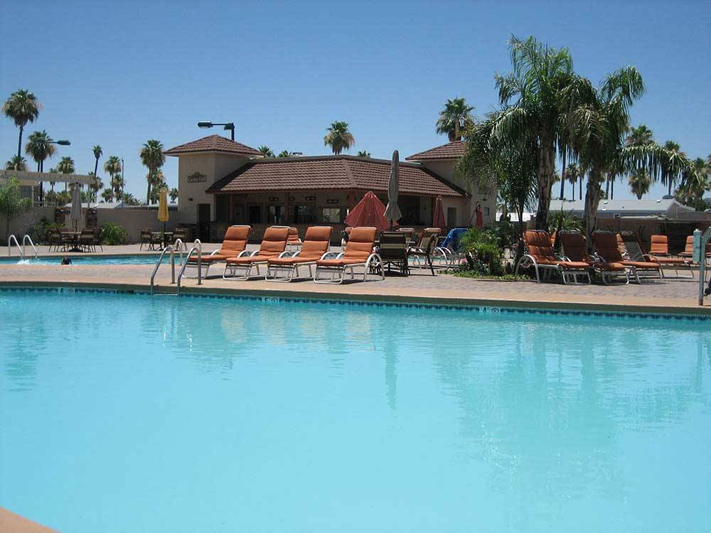 Swimming pool with outdoor seating at GOOD LIFE RV RESORT