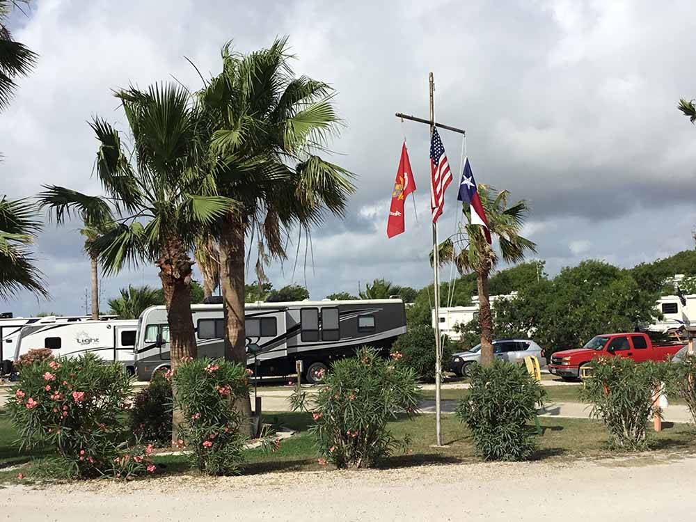 A flag pole sitting in front of RV sites at SEA BREEZE RV COMMUNITY RESORT
