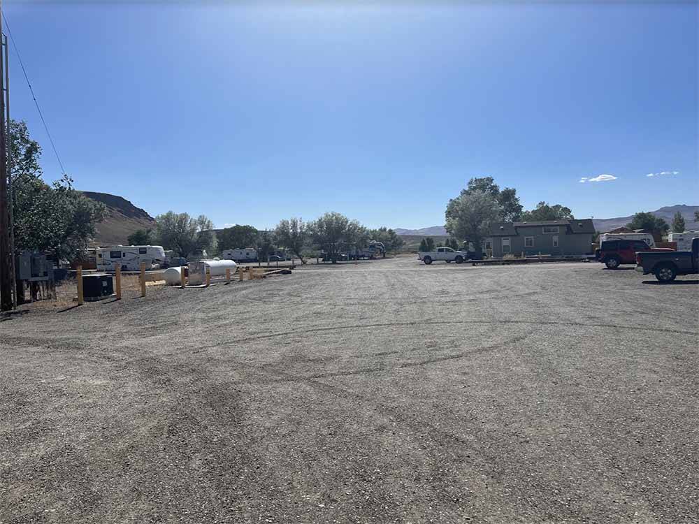 A large gravel area and propane fill station at ELKO RV PARK
