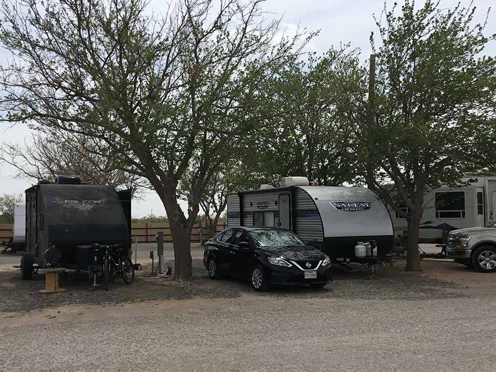 A line of travel trailers at MIDLAND RV CAMPGROUND