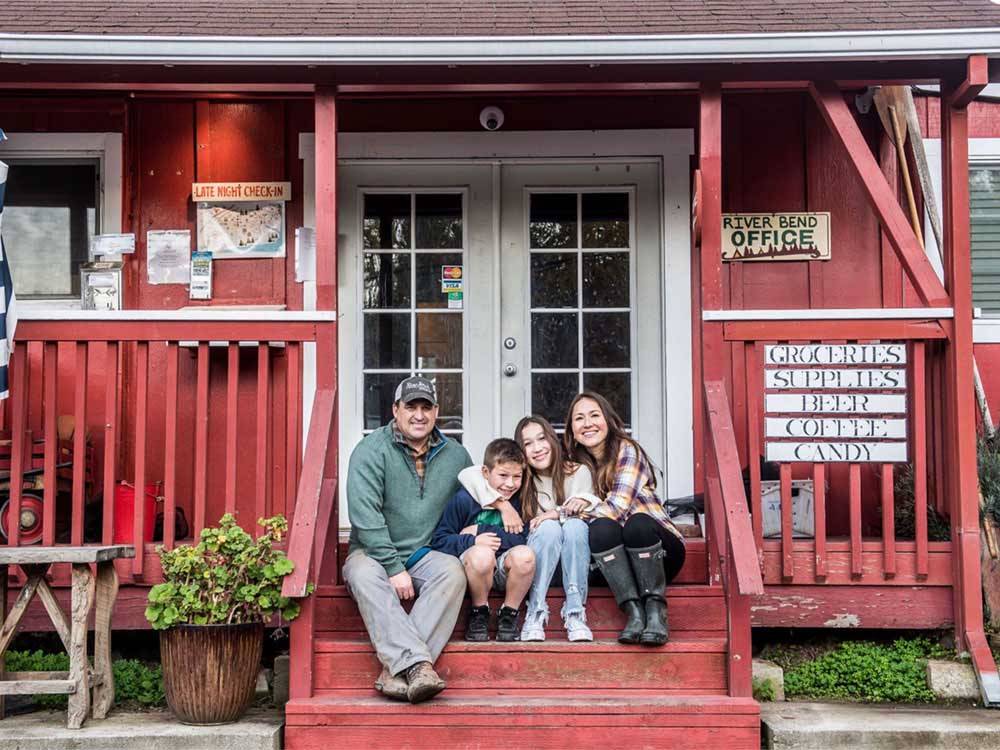 A family outside the general store at RIVER BEND RESORT