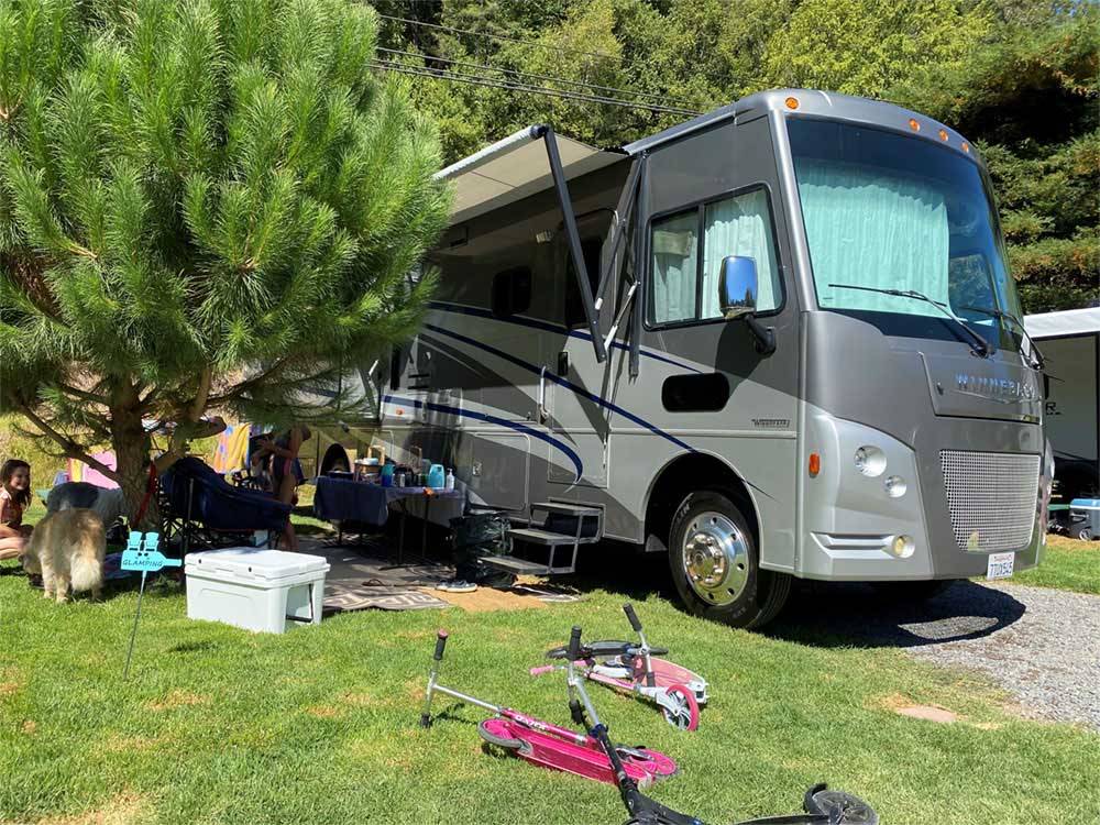 A Class A motorhome parked on-site at RIVER BEND RESORT