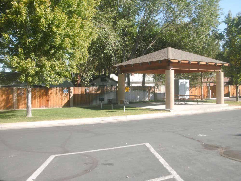 Patio area with picnic table at SILVER SAGE RV PARK