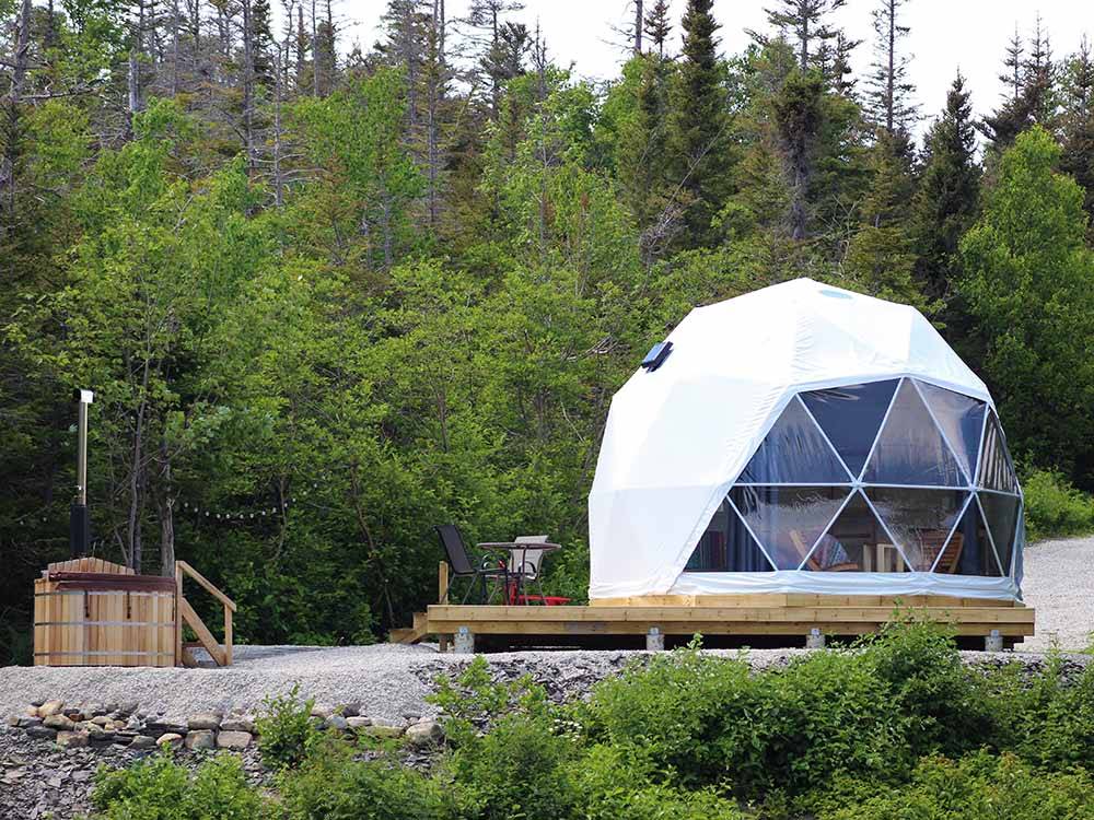 A glamping geodesic dome and hot tub at GROS MORNE/NORRIS POINT KOA