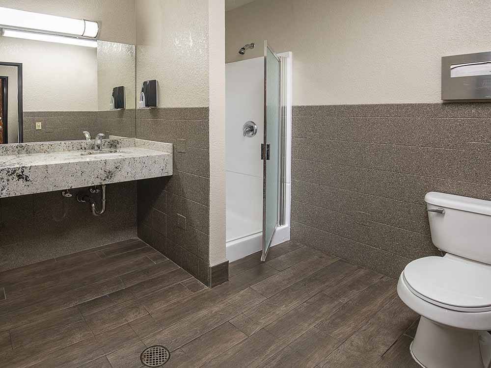 A very clean bathroom with a shower at ARIZONA CHARLIE'S BOULDER RV PARK