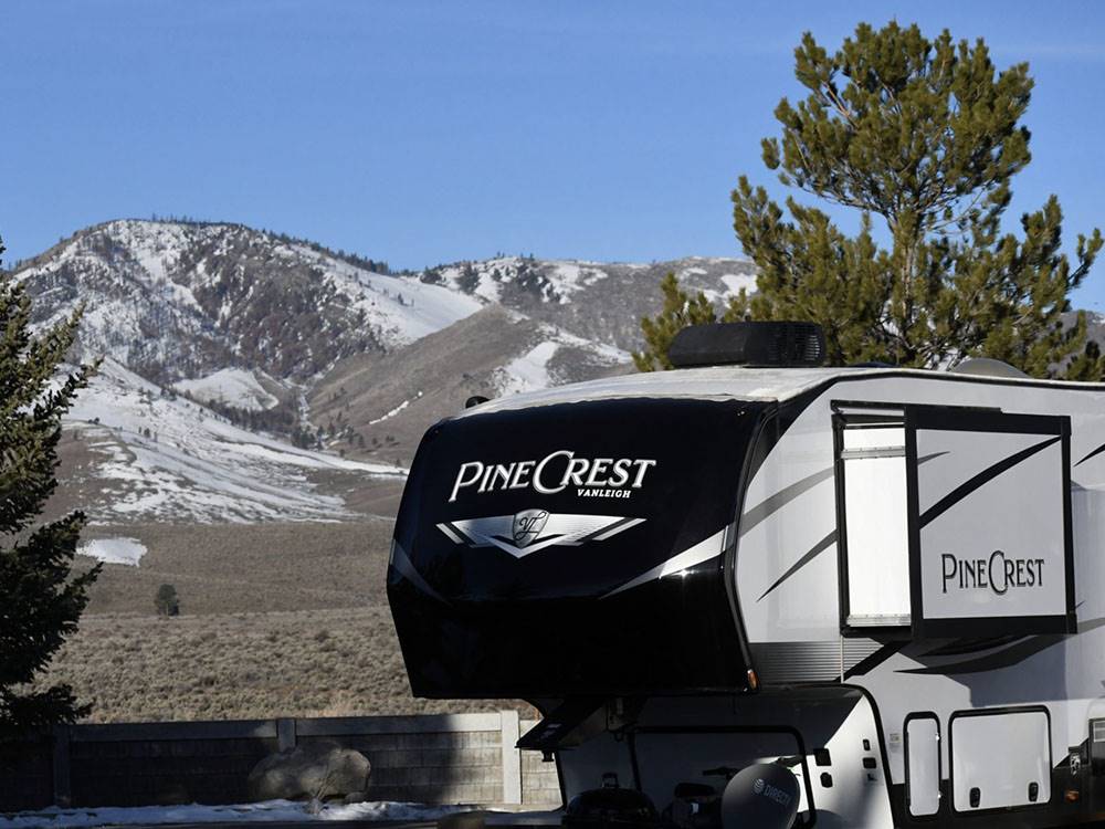 A fifth wheel trailer parked with mountain in the background at BORDERTOWN CASINO & RV RESORT