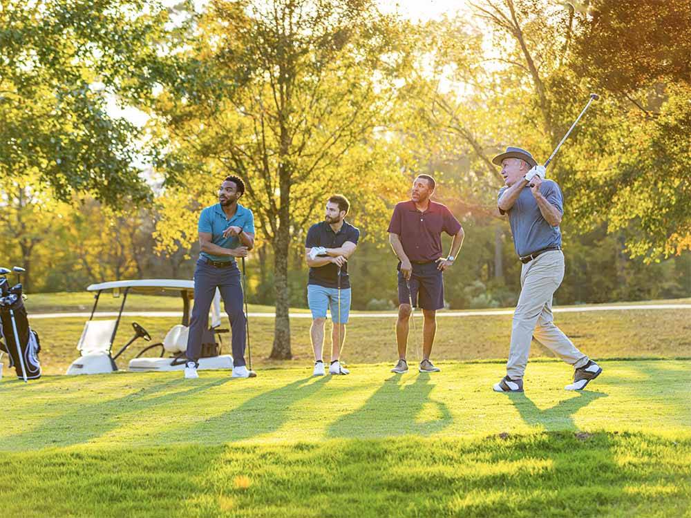 Four men playing golf at PARAGON CASINO RV RESORT