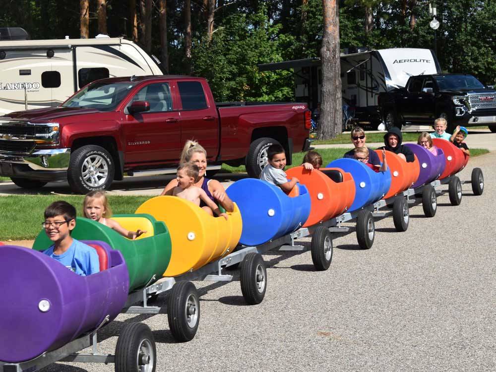 Kids on a train made of 55 gallon drums at VACATION STATION RV RESORT