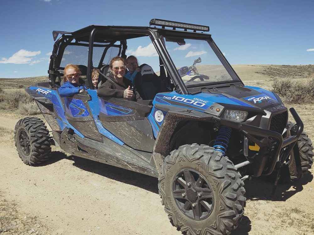 A group of people riding in a ATV at THE LONGHORN RANCH LODGE AND RV RESORT