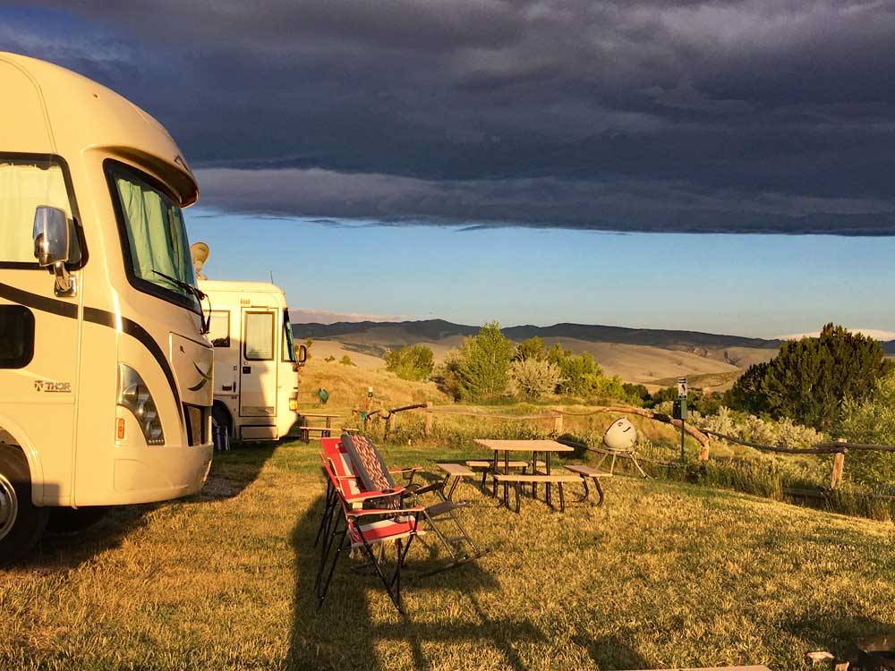 RVs in grass sites with views at SLEEPING BEAR RV PARK & CAMPGROUND