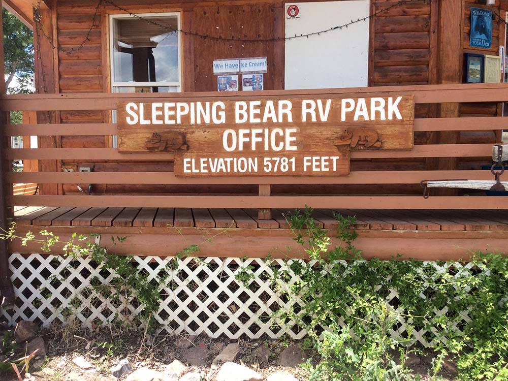 Sign for office and elevation at SLEEPING BEAR RV PARK & CAMPGROUND