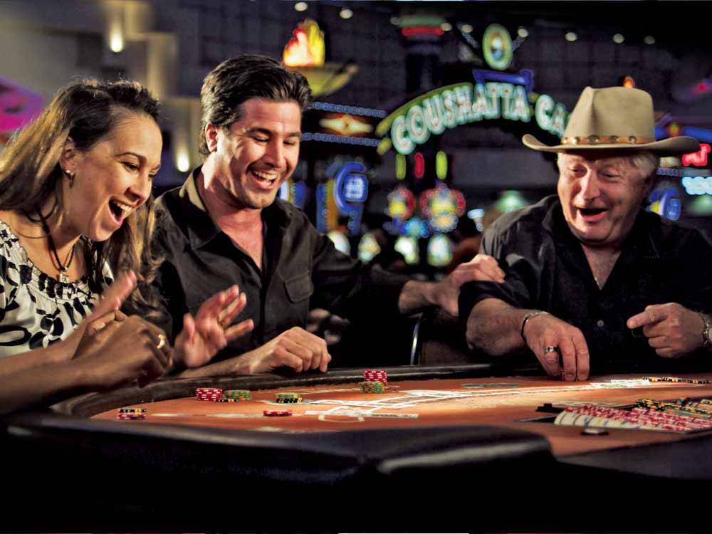 Three people playing blackjack at COUSHATTA LUXURY RV RESORT AT RED SHOES PARK