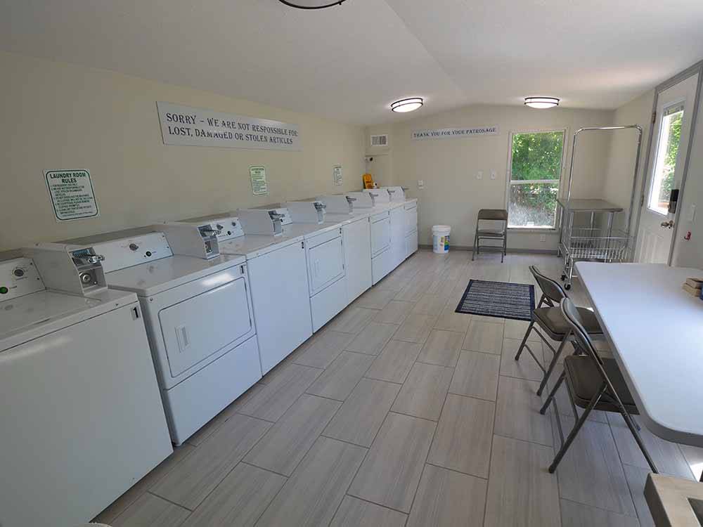 Inside of the clean & modern laundry room at COLORADO LANDING RV PARK