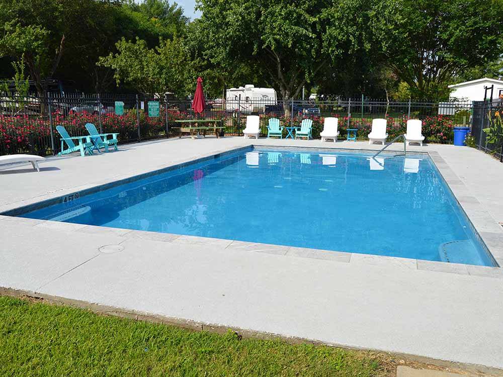 The pool area with seating at COLORADO LANDING RV PARK