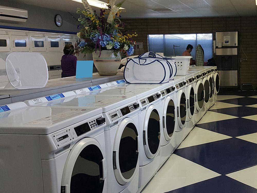 Laundry room with washers and dryers at FAR HORIZONS RV RESORT