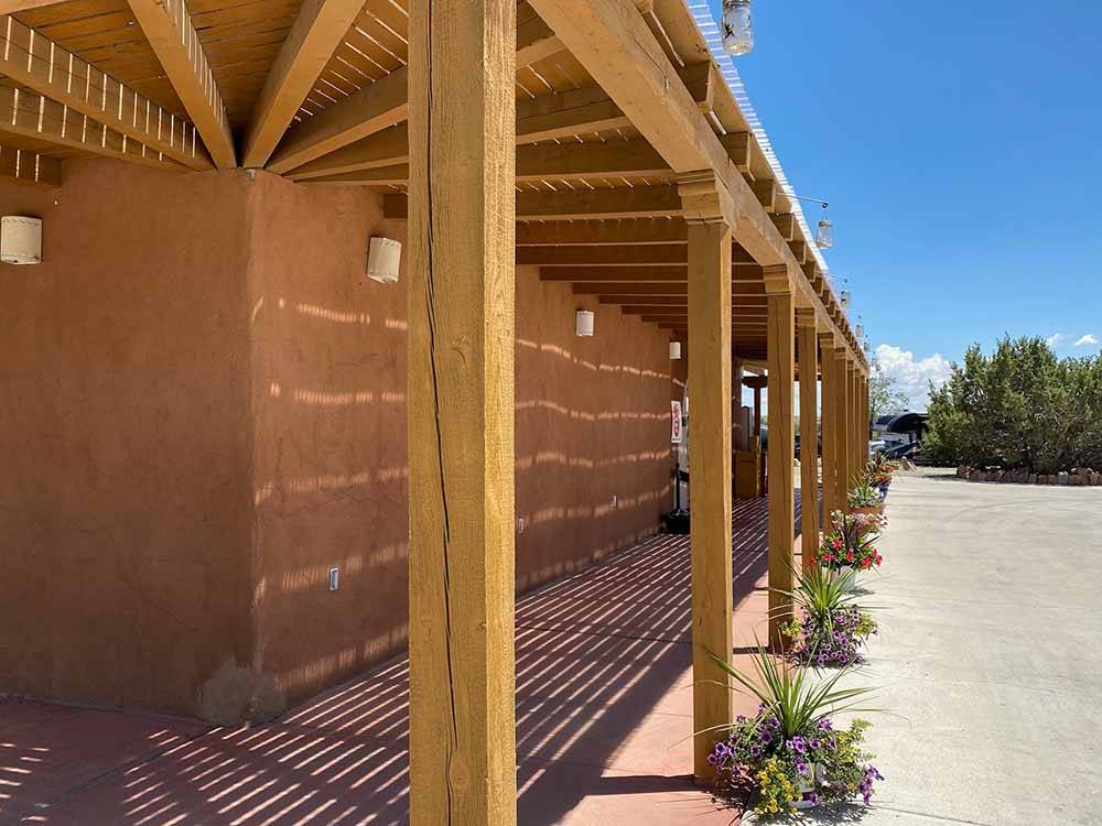 The covered porch on the main building at SANTA FE SKIES RV PARK