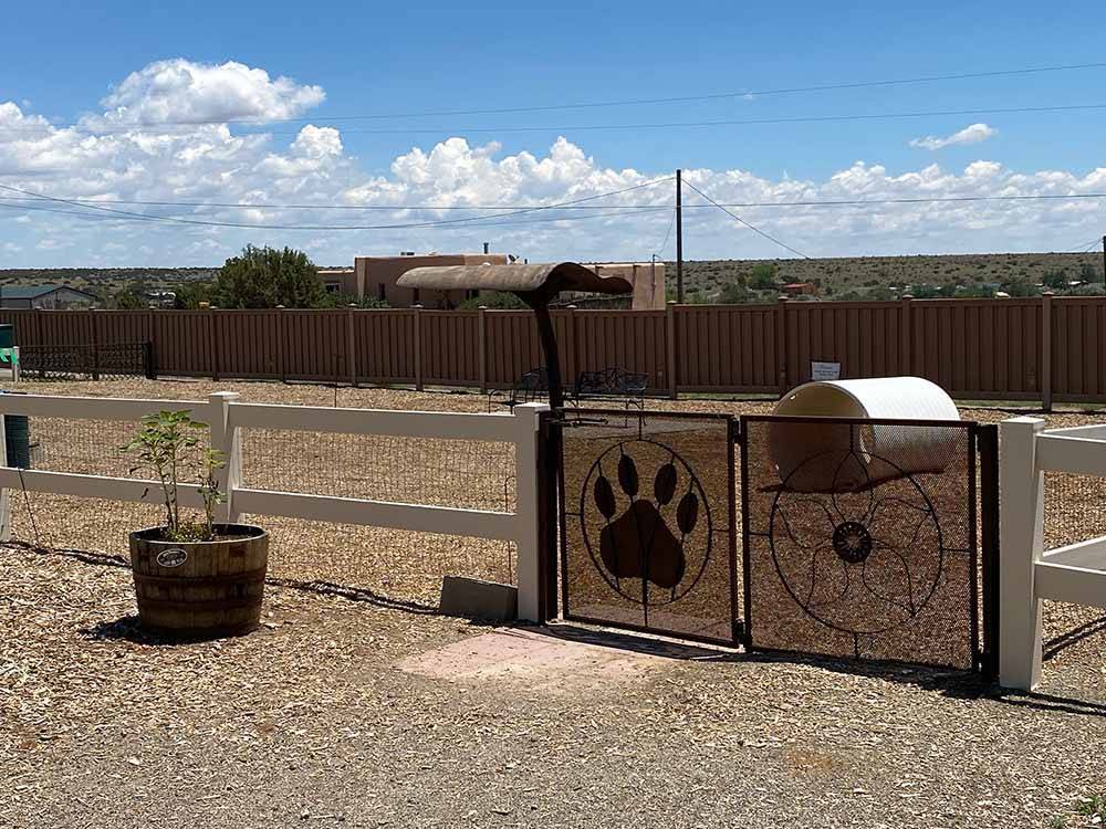 The fenced in pet area at SANTA FE SKIES RV PARK