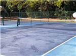 The fenced in tennis ball court at RALEIGH OAKS RV RESORT & COTTAGES - thumbnail