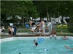 Guests enjoying the swimming pool at GREEN ACRES FAMILY CAMPGROUND - thumbnail