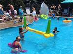 Kids playing in the swimming pool at CEDARLANE RV RESORT - thumbnail