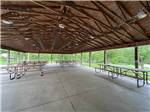 A large pavilion with picnic tables at MAPLE LAKES RECREATIONAL PARK - thumbnail