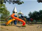 Slides at park playground at BRENNAN BEACH CAMPGROUND - thumbnail
