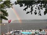 Rainbow over community swimming pool at LAKE GASTON AMERICAMPS - thumbnail