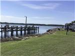 An empty pier with RV sites along the water at TOM'S COVE PARK - thumbnail