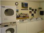 Laundry room with clock and pictures at DEER PARK - thumbnail