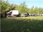 Trailers and RVs parked in the woods at DEER PARK - thumbnail